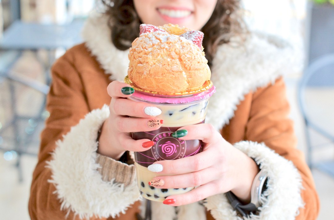 Photo of a fancy boba specialty that comes with a dessert